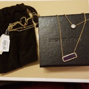 A brand new Michael Kors necklace